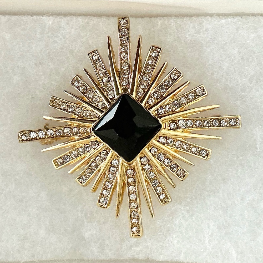 Rhinestone and black stone brooch